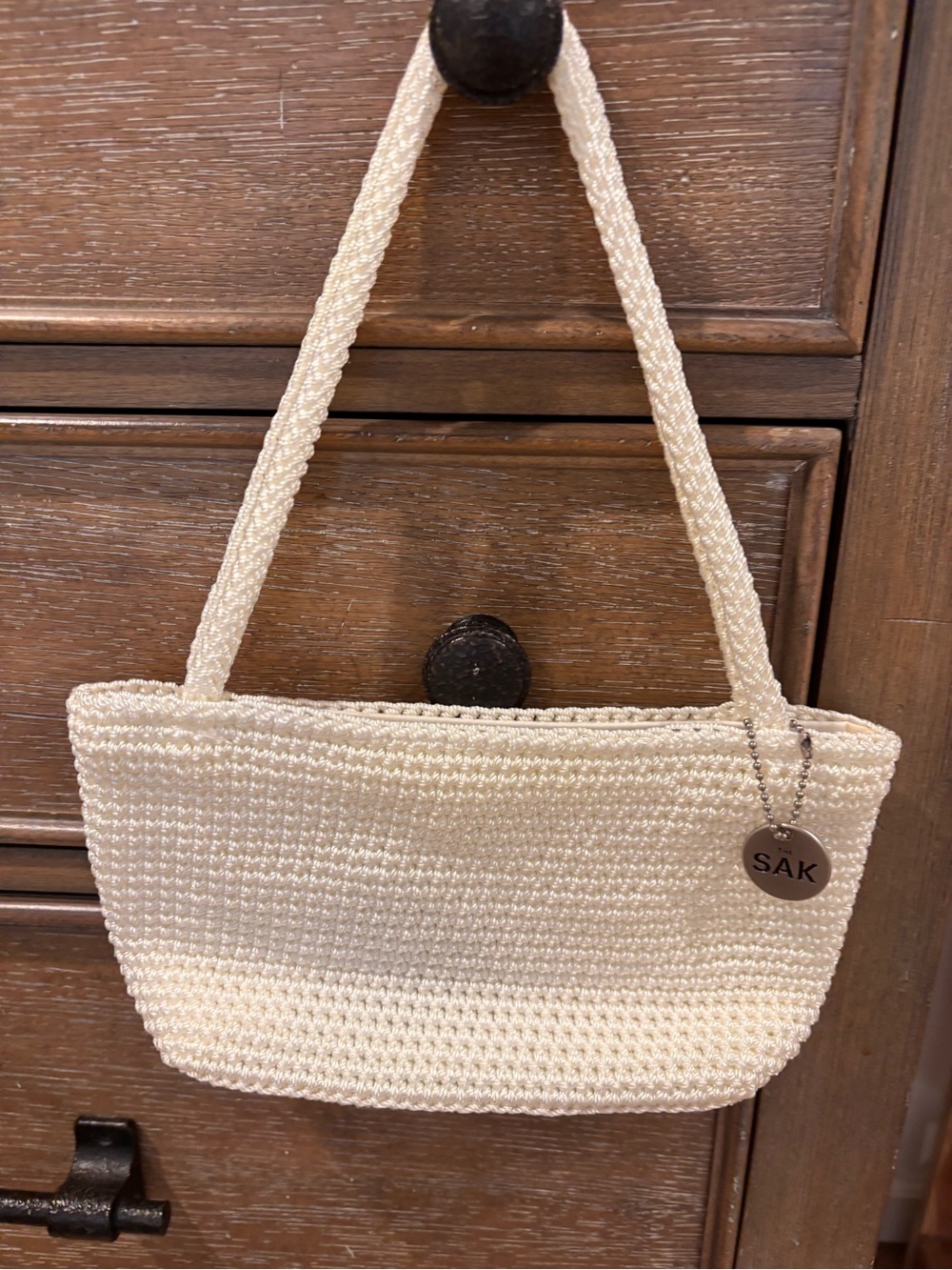 The Sak Cream Crochet Shoulder Bag with Branded Charm